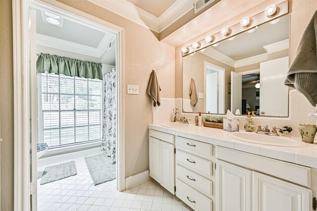 114 Wyndwood Dr, Seabrook, TX 77586 - bathroom featuring ornamental molding, double vanity, tile patterned floors, and ceiling fan