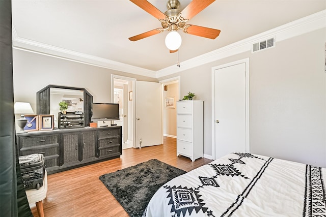 114 Wyndwood Dr, Seabrook, TX 77586 - bedroom with crown molding, wood finished floors, and ceiling fan