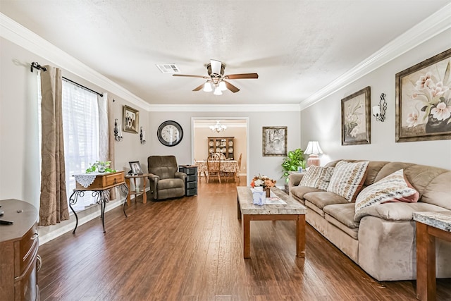 114 Wyndwood Dr, Seabrook, TX 77586 - living room featuring ceiling fan, dark wood finished floors, crown molding, and a chandelier