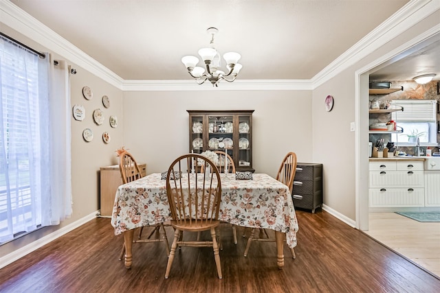 114 Wyndwood Dr, Seabrook, TX 77586 - dining area with a chandelier, wood finished floors, and ornamental molding