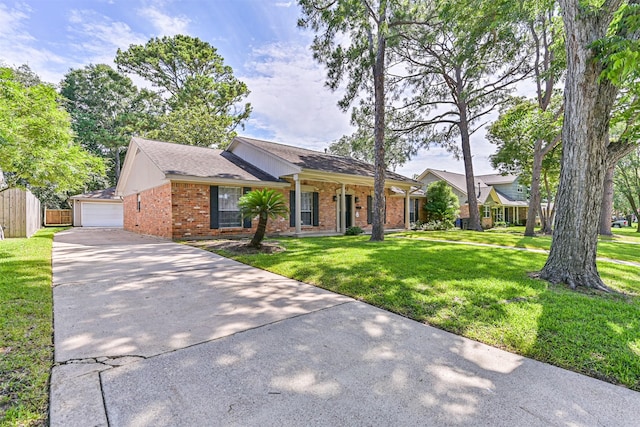 114 Wyndwood Dr, Seabrook, TX 77586 - ranch-style home featuring brick siding, driveway, roof with shingles, and a garage