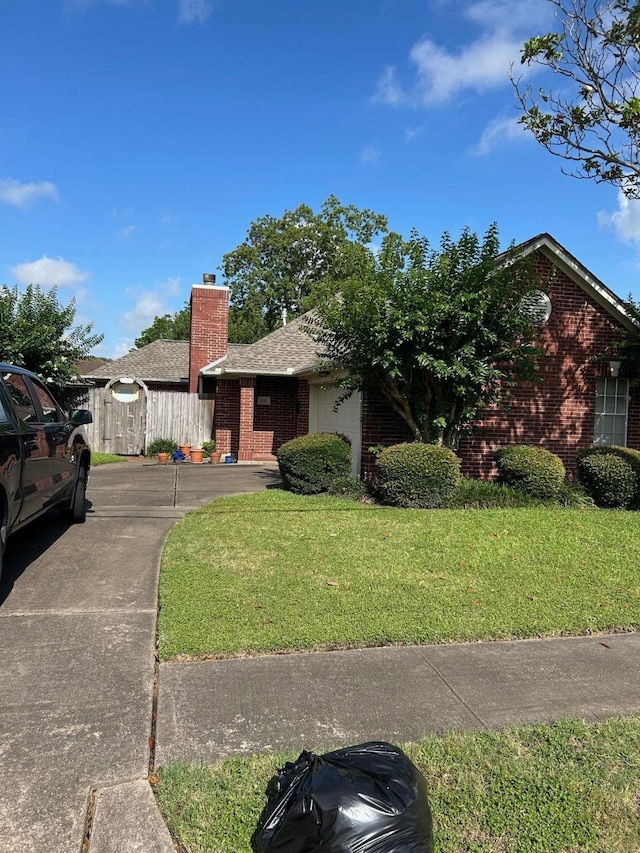 1110 Ivy Ave, Deer Park, TX 77536 - single story home with brick siding, a chimney, and a shingled roof