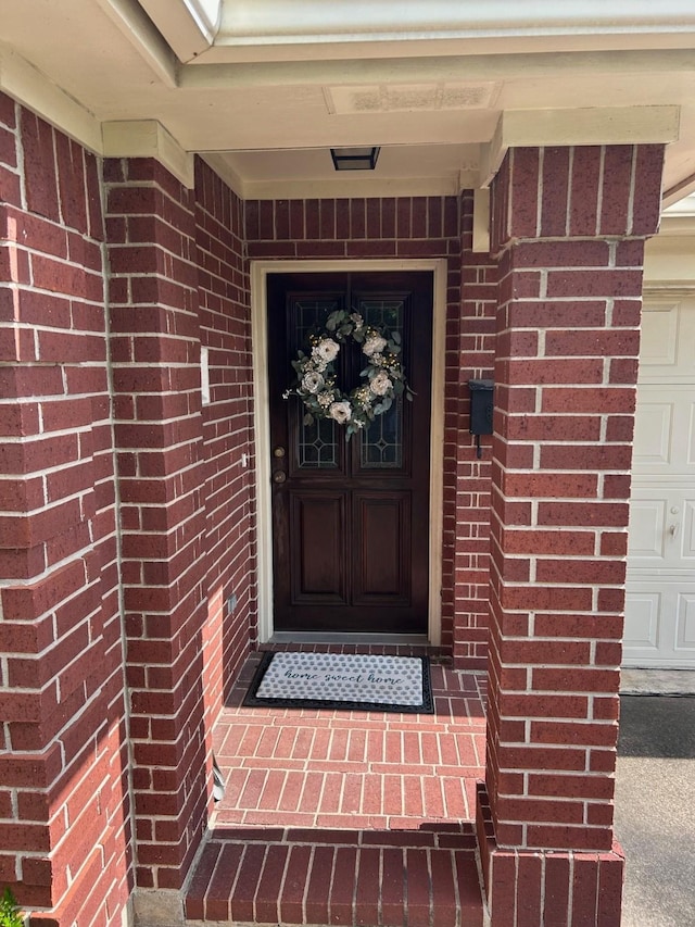 1110 Ivy Ave, Deer Park, TX 77536 - doorway to property with a garage and brick siding