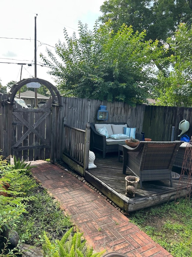 1110 Ivy Ave, Deer Park, TX 77536 - wooden deck featuring outdoor lounge area and a gate