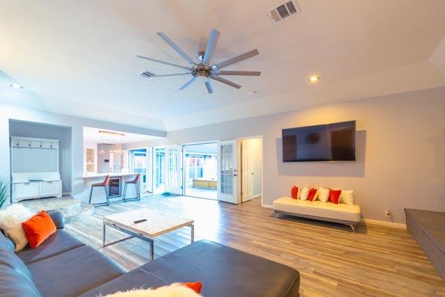 230 White Cedar St, Houston, TX 77015 - living area with ceiling fan, wood finished floors, recessed lighting, and a raised ceiling