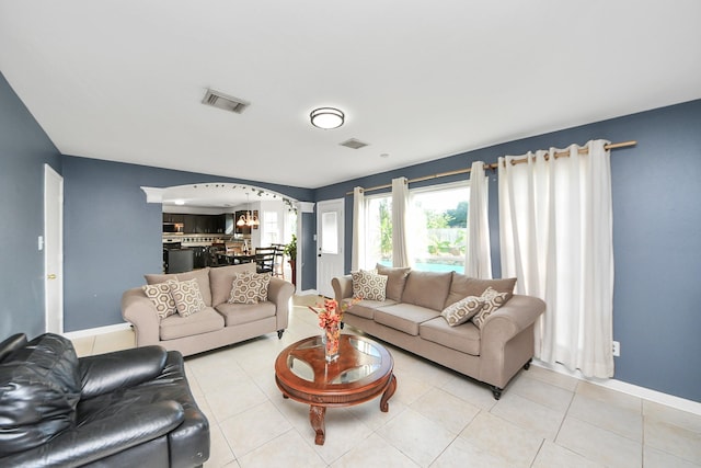 14907 Leila Oaks Cir, Houston, TX 77082 - living area with arched walkways and light tile patterned flooring