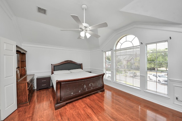 14907 Leila Oaks Cir, Houston, TX 77082 - bedroom with lofted ceiling, wood finished floors, a wainscoted wall, and ceiling fan