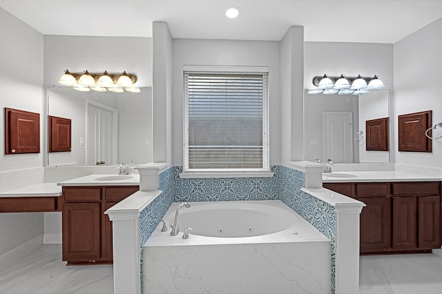 706 Overdell Dr, Sugar Land, TX 77479 - bathroom featuring a tub with jets and two vanities