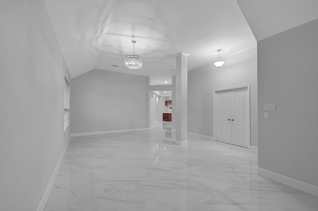 706 Overdell Dr, Sugar Land, TX 77479 - spare room with light marble finish flooring, a chandelier, and vaulted ceiling