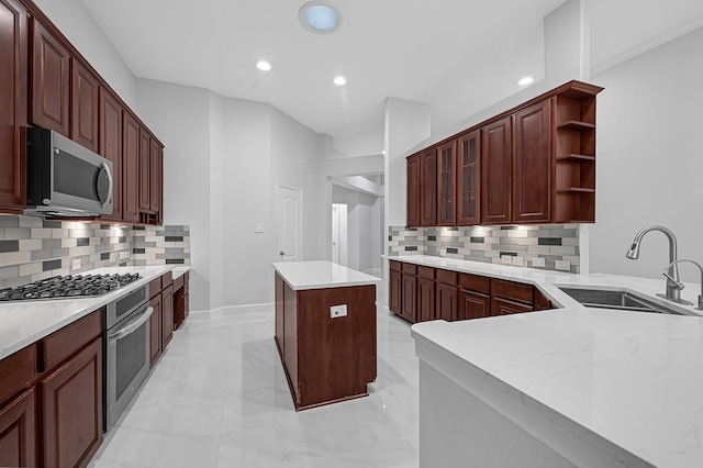 706 Overdell Dr, Sugar Land, TX 77479 - kitchen with stainless steel appliances, open shelves, recessed lighting, a kitchen island, and tasteful backsplash