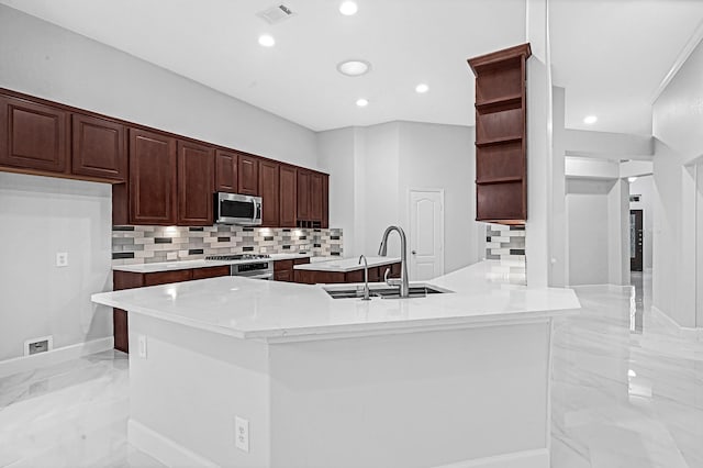 706 Overdell Dr, Sugar Land, TX 77479 - kitchen with open shelves, stainless steel microwave, light marble finish flooring, decorative backsplash, and light countertops