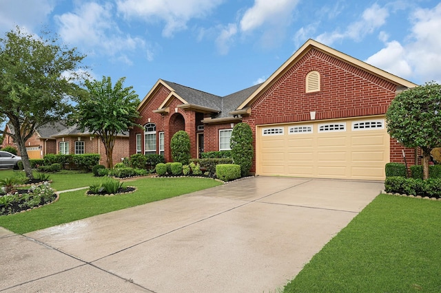 706 Overdell Dr, Sugar Land, TX 77479 - ranch-style house featuring brick siding, concrete driveway, a front yard, and an attached garage