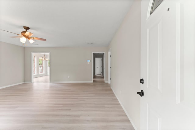 519 Tallow Dr, Conroe, TX 77385 - unfurnished room with a chandelier, a ceiling fan, and light wood finished floors