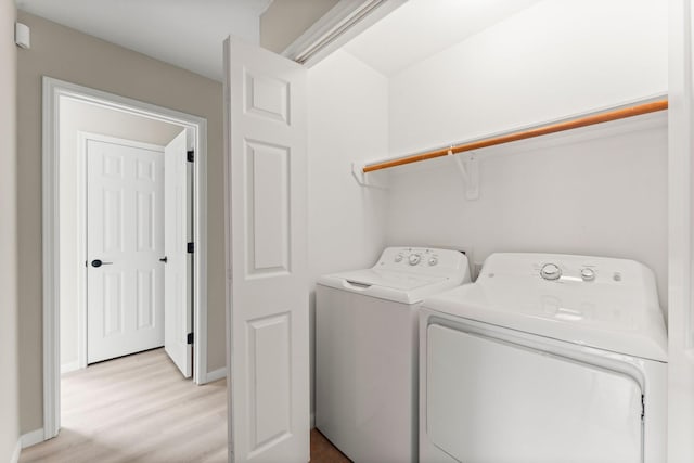 519 Tallow Dr, Conroe, TX 77385 - laundry room featuring independent washer and dryer and light wood finished floors