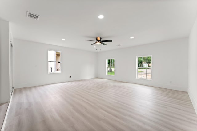 519 Tallow Dr, Conroe, TX 77385 - empty room with a ceiling fan, light wood-type flooring, and recessed lighting