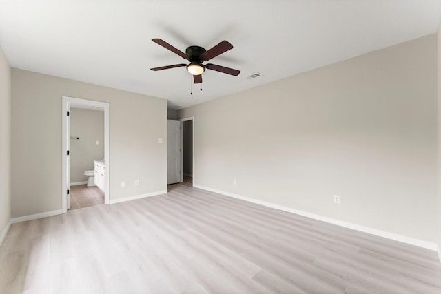 519 Tallow Dr, Conroe, TX 77385 - unfurnished bedroom featuring light wood-type flooring, ensuite bathroom, and ceiling fan