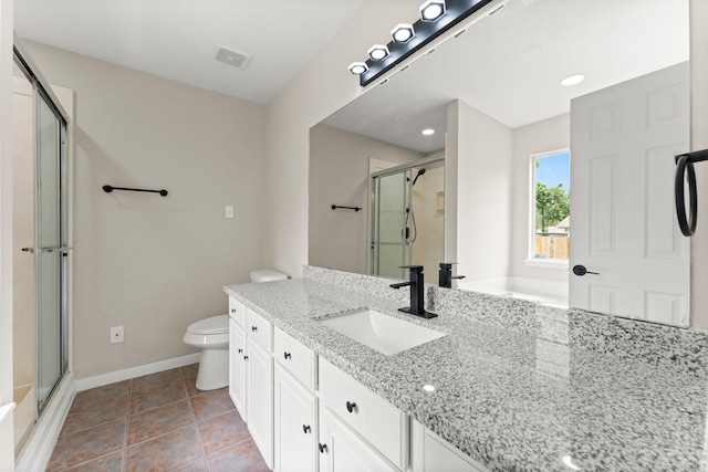 519 Tallow Dr, Conroe, TX 77385 - full bathroom featuring a shower with shower door, vanity, and tile patterned floors