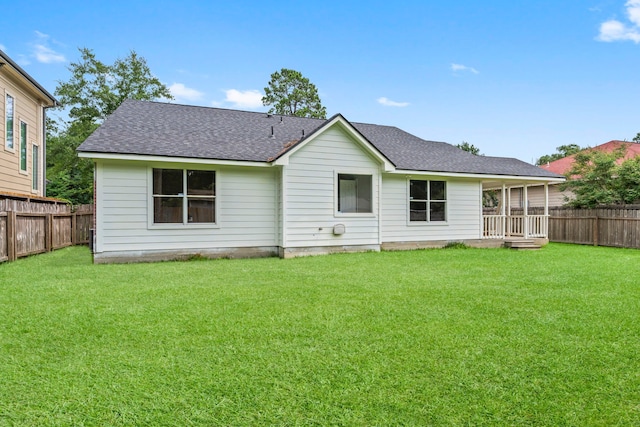 519 Tallow Dr, Conroe, TX 77385 - rear view of house with roof with shingles and a fenced backyard