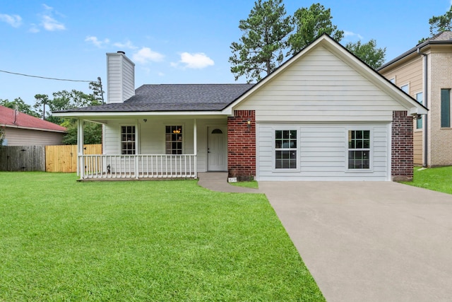 519 Tallow Dr, Conroe, TX 77385 - view of front of home featuring roof with shingles, a porch, and a chimney