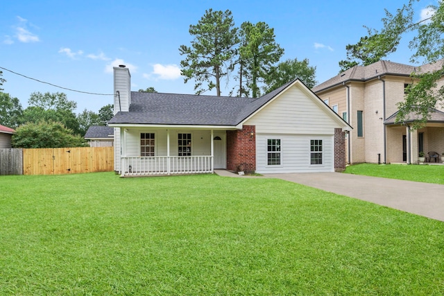 519 Tallow Dr, Conroe, TX 77385 - view of front of property featuring covered porch, a chimney, concrete driveway, a shingled roof, and brick siding