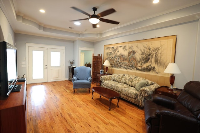212 Greenwood St, Houston, TX 77011 - living area with a ceiling fan, light wood-style flooring, crown molding, recessed lighting, and a raised ceiling