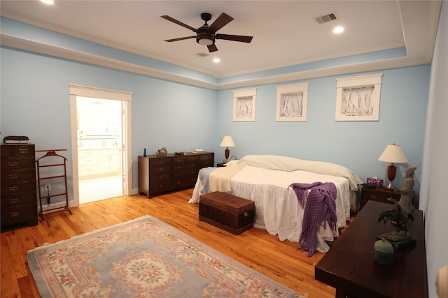 212 Greenwood St, Houston, TX 77011 - bedroom featuring wood finished floors, a tray ceiling, ceiling fan, and recessed lighting