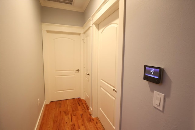 212 Greenwood St, Houston, TX 77011 - corridor featuring light wood-type flooring and baseboards