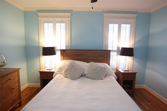 212 Greenwood St, Houston, TX 77011 - bedroom with dark wood finished floors and crown molding