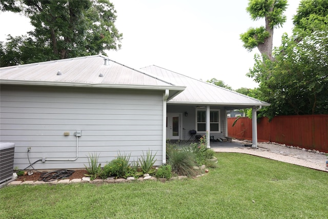 212 Greenwood St, Houston, TX 77011 - rear view of house with a patio and a metal roof