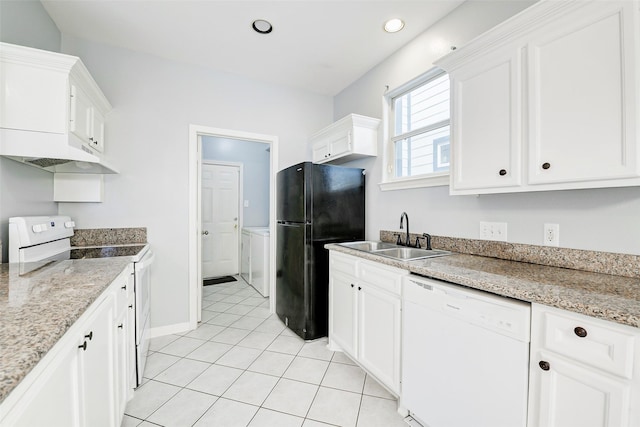 7130 Eastwood St, Houston, TX 77021 - kitchen featuring white appliances, under cabinet range hood, white cabinets, light tile patterned flooring, and light stone counters
