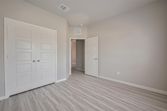 27302 Blue Pool Dr, Katy, TX 77493 - unfurnished bedroom featuring light wood-type flooring and a closet