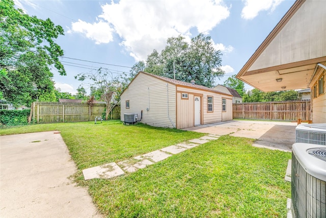 1309 Jefferson St, Baytown, TX 77520 - fenced backyard with a patio area and an outbuilding