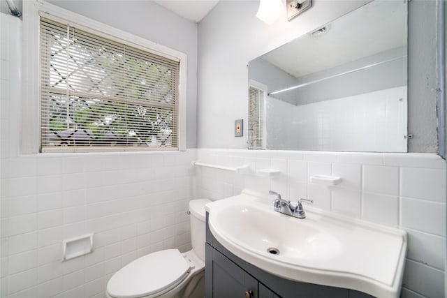 1309 Jefferson St, Baytown, TX 77520 - full bath featuring tile walls, vanity, a shower, and wainscoting