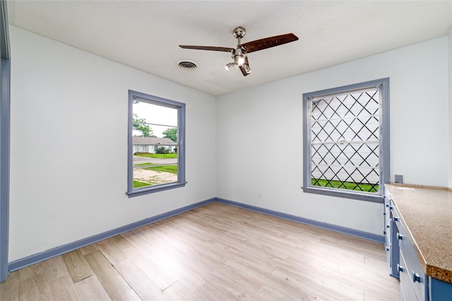 1309 Jefferson St, Baytown, TX 77520 - spare room with light wood-type flooring and a ceiling fan