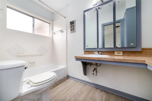1309 Jefferson St, Baytown, TX 77520 - full bath with shower / tub combination and wood finished floors