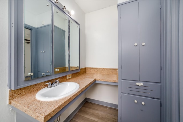 1309 Jefferson St, Baytown, TX 77520 - bathroom featuring wood finished floors and vanity