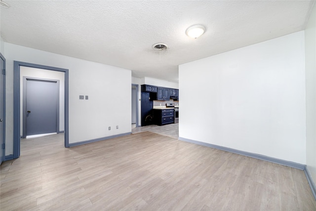 1309 Jefferson St, Baytown, TX 77520 - spare room with light wood-style floors and a textured ceiling