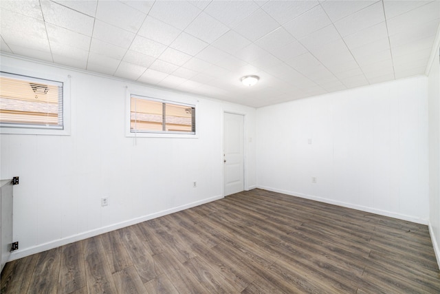 1309 Jefferson St, Baytown, TX 77520 - unfurnished room featuring dark wood-type flooring and baseboards
