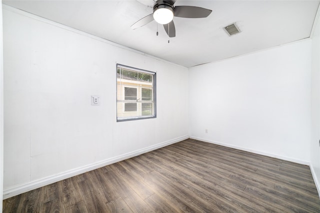 1309 Jefferson St, Baytown, TX 77520 - empty room featuring dark wood-style flooring and a ceiling fan