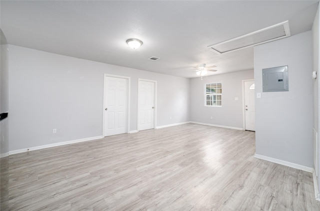 1309 Jefferson St, Baytown, TX 77520 - empty room with attic access, electric panel, light wood-type flooring, and a ceiling fan