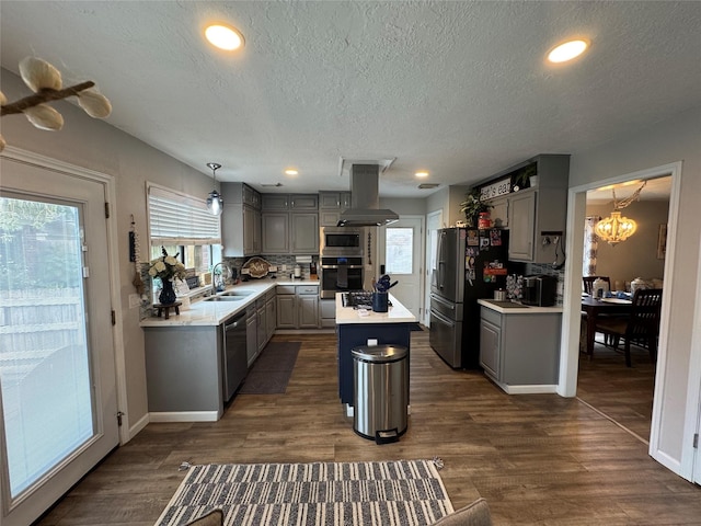 128 Hidden Lake Dr, League City, TX 77573 - kitchen with appliances with stainless steel finishes, gray cabinetry, island exhaust hood, a chandelier, and a textured ceiling