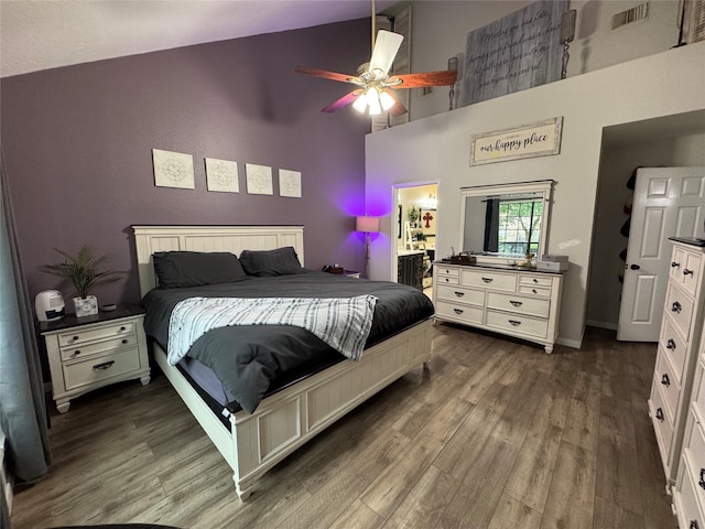 128 Hidden Lake Dr, League City, TX 77573 - bedroom featuring high vaulted ceiling, dark wood-style flooring, a ceiling fan, and ensuite bath