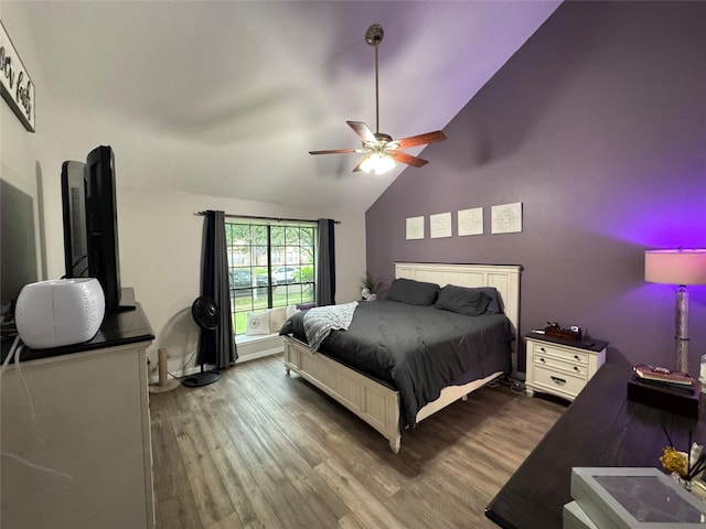 128 Hidden Lake Dr, League City, TX 77573 - bedroom with lofted ceiling, wood finished floors, and a ceiling fan