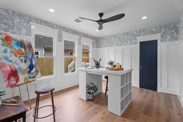 1543 Columbia St, Houston, TX 77008 - office space with wallpapered walls, a decorative wall, a ceiling fan, light wood-type flooring, and wainscoting