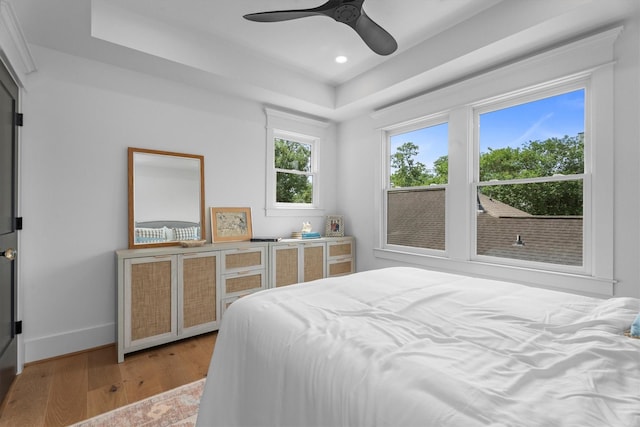 1543 Columbia St, Houston, TX 77008 - bedroom with a tray ceiling, light wood-style floors, recessed lighting, and a ceiling fan