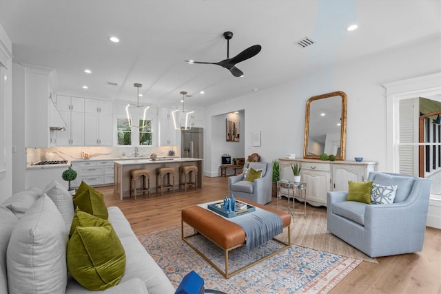 1543 Columbia St, Houston, TX 77008 - living area with a ceiling fan, light wood-style flooring, and recessed lighting
