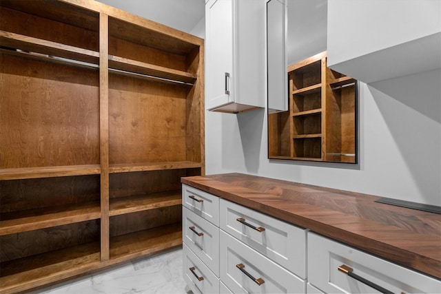 1543 Columbia St, Houston, TX 77008 - walk in closet featuring light marble finish flooring