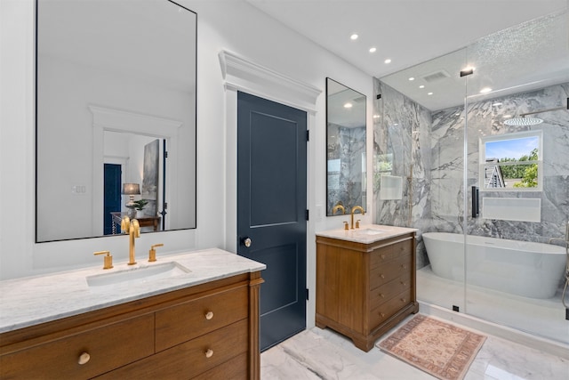 1543 Columbia St, Houston, TX 77008 - full bath featuring marble look tiles, two vanities, a freestanding tub, a marble finish shower, and recessed lighting
