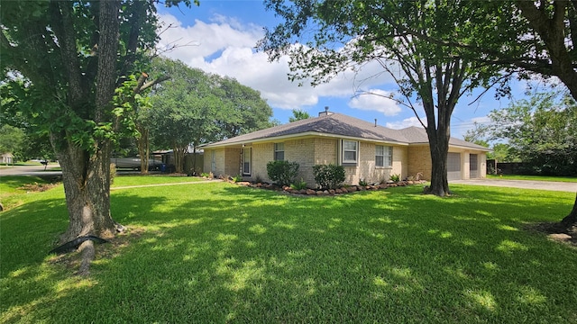 2402 Heather St, Highlands, TX 77562 - view of property exterior with an attached garage, a lawn, brick siding, driveway, and a chimney