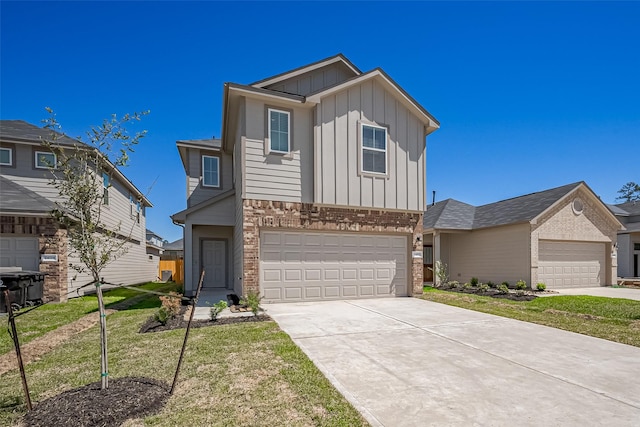 24711 Sonora Crescent Cir, Huffman, TX 77336 - traditional-style home featuring board and batten siding, brick siding, driveway, a front yard, and an attached garage